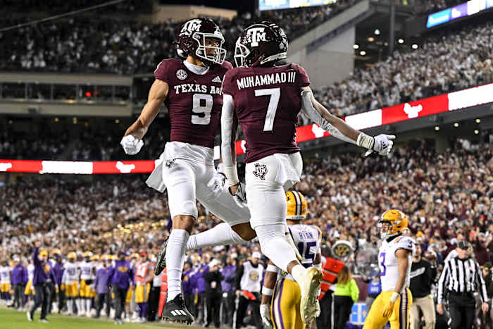 Texas A&M football players celebrate a touchdown.